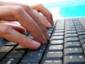 1412359-close-up-shot-of-fingers-typing-on-computer-keyboard